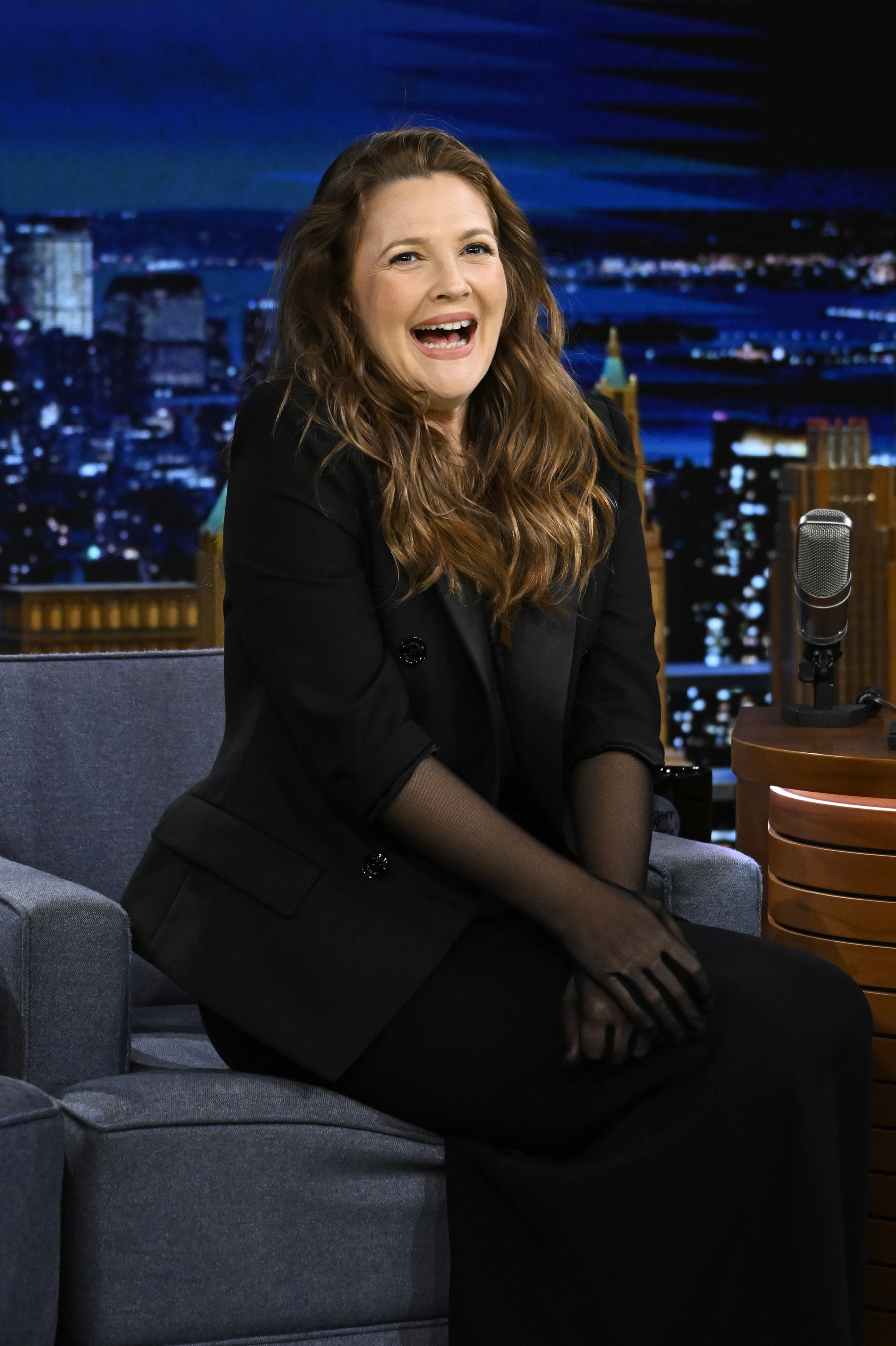 Closeup of Drew Barrymore smiling during a talk show interview