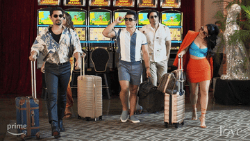 gif of a group of people walking through an airport confidently in slow motion