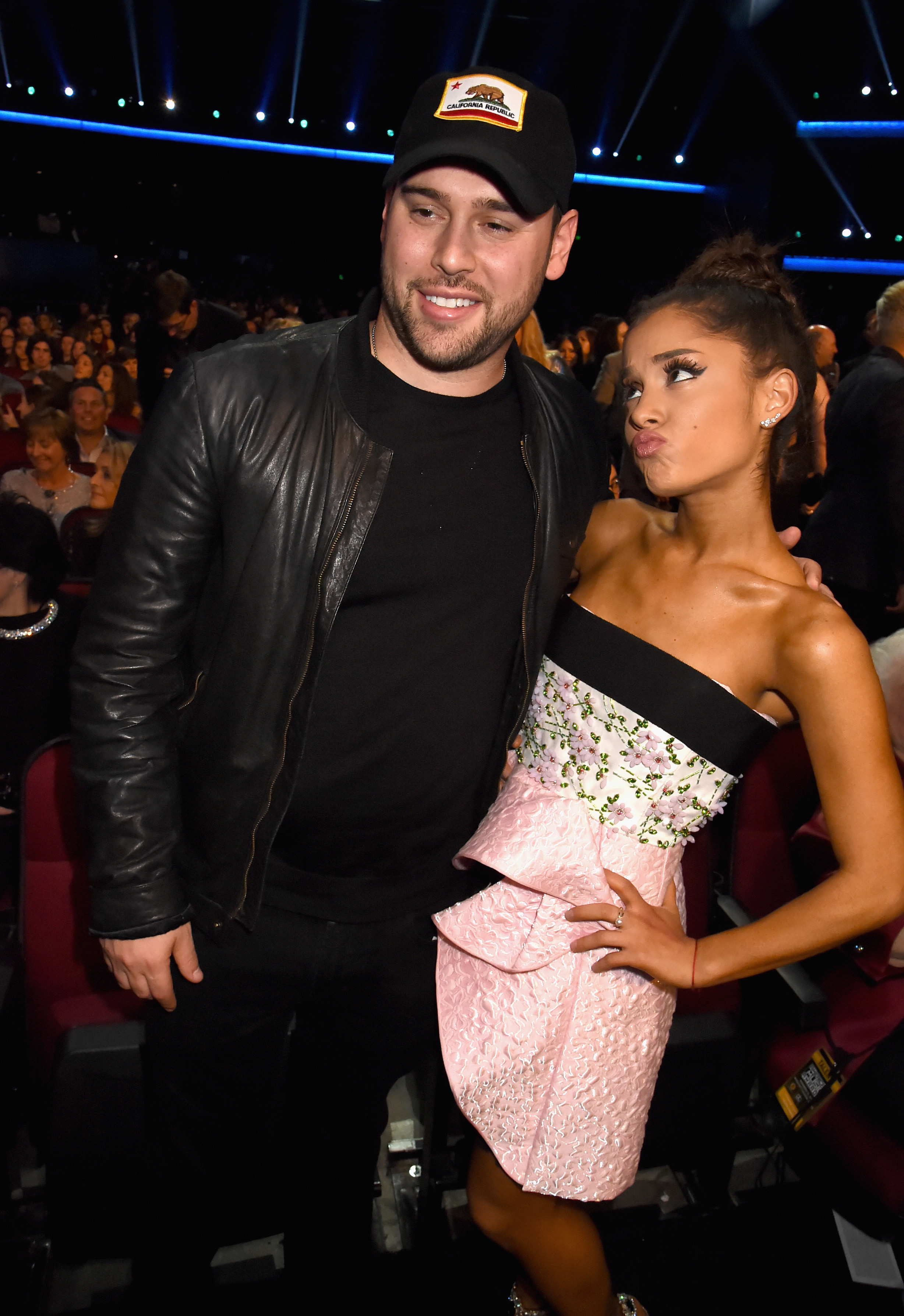 A close-up of Scooter and Ariana at a public event