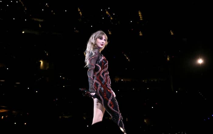 Close-up of Taylor performing onstage