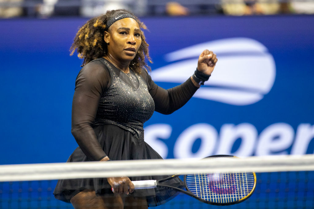 Serena raising her fist on the court