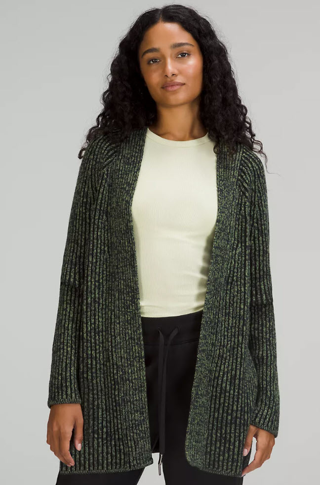 model wearing an olive knit oversized cardigan