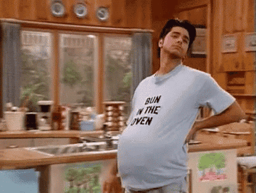Uncle Jesse from Full House walking around with pillow under shirt