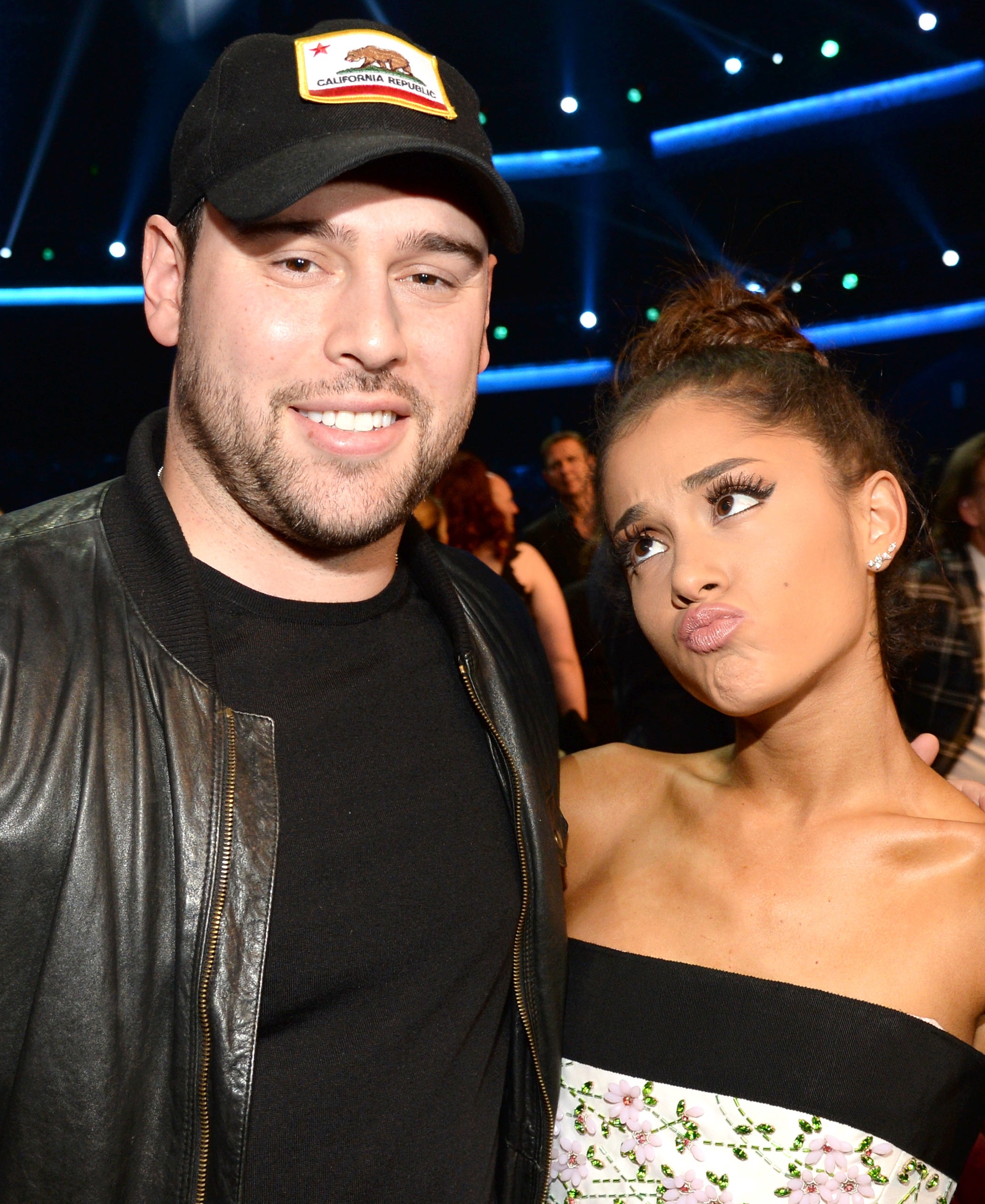 A closeup of Scooter Braun and Ariana Grande who&#x27;s making a silly pouting face