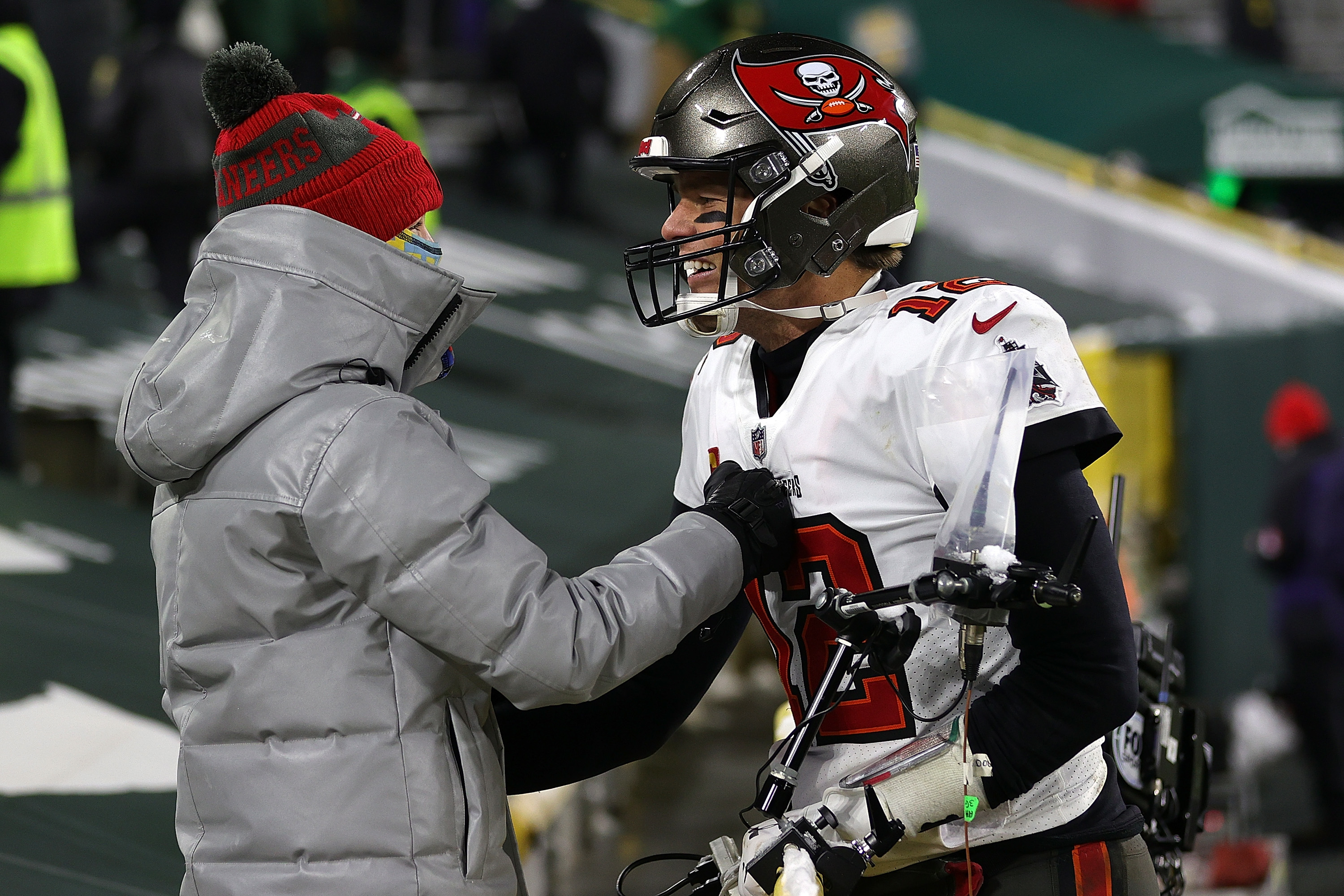 Tom Brady greeting Jack on the field