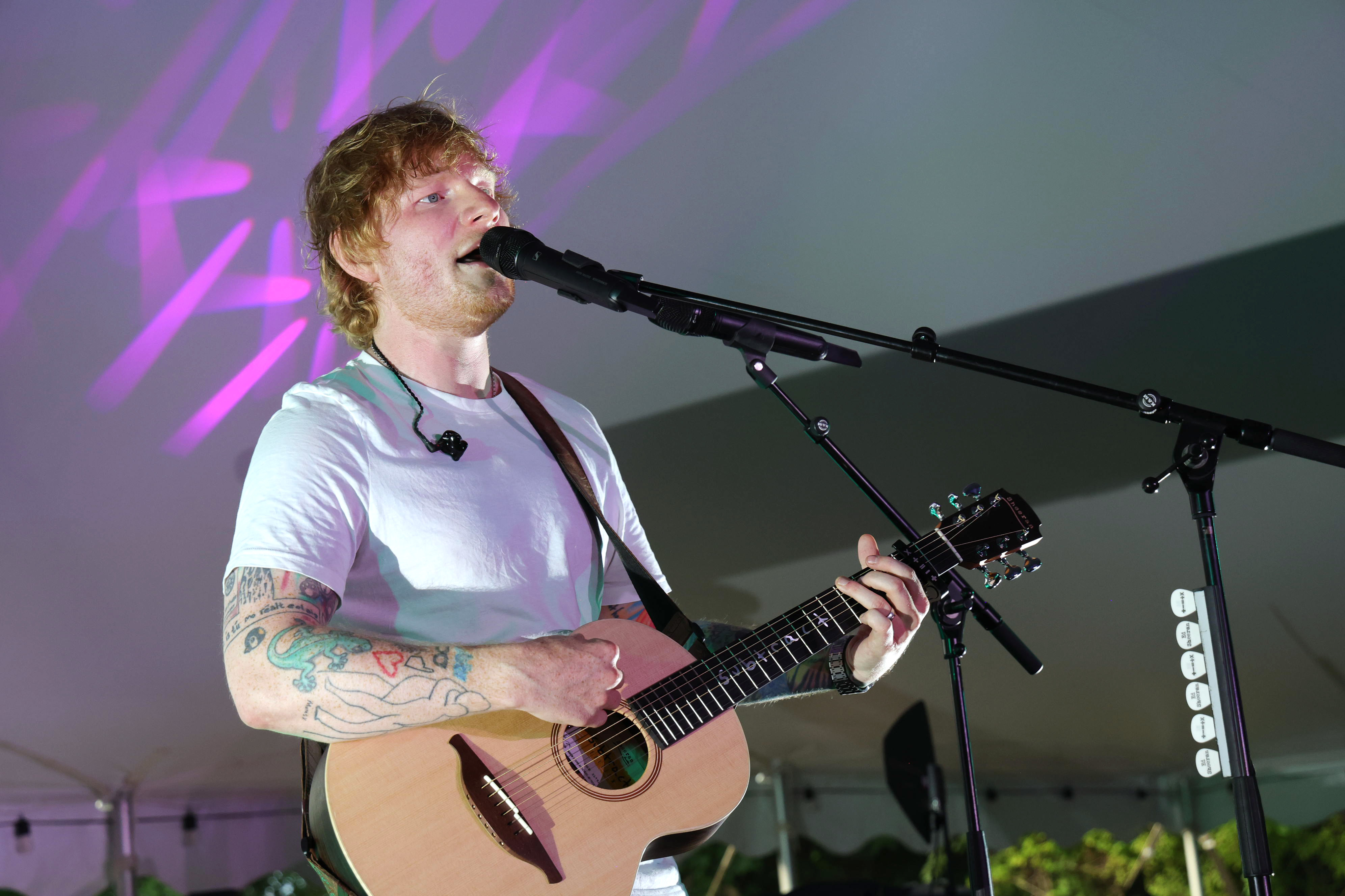 Ed Sheeran onstage playing the guitar