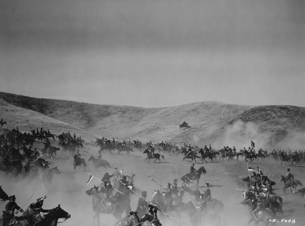 A battle scene with men on horses