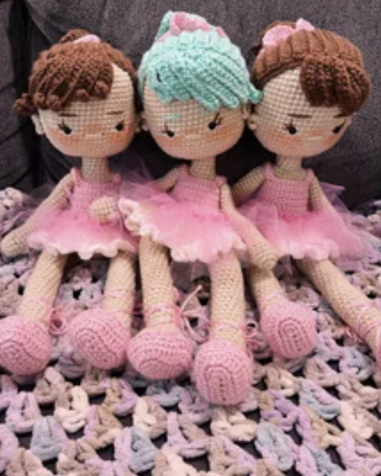 three crocheted ballerina dolls
