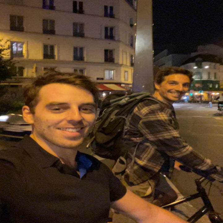 my brother and me riding bikes in Paris at night