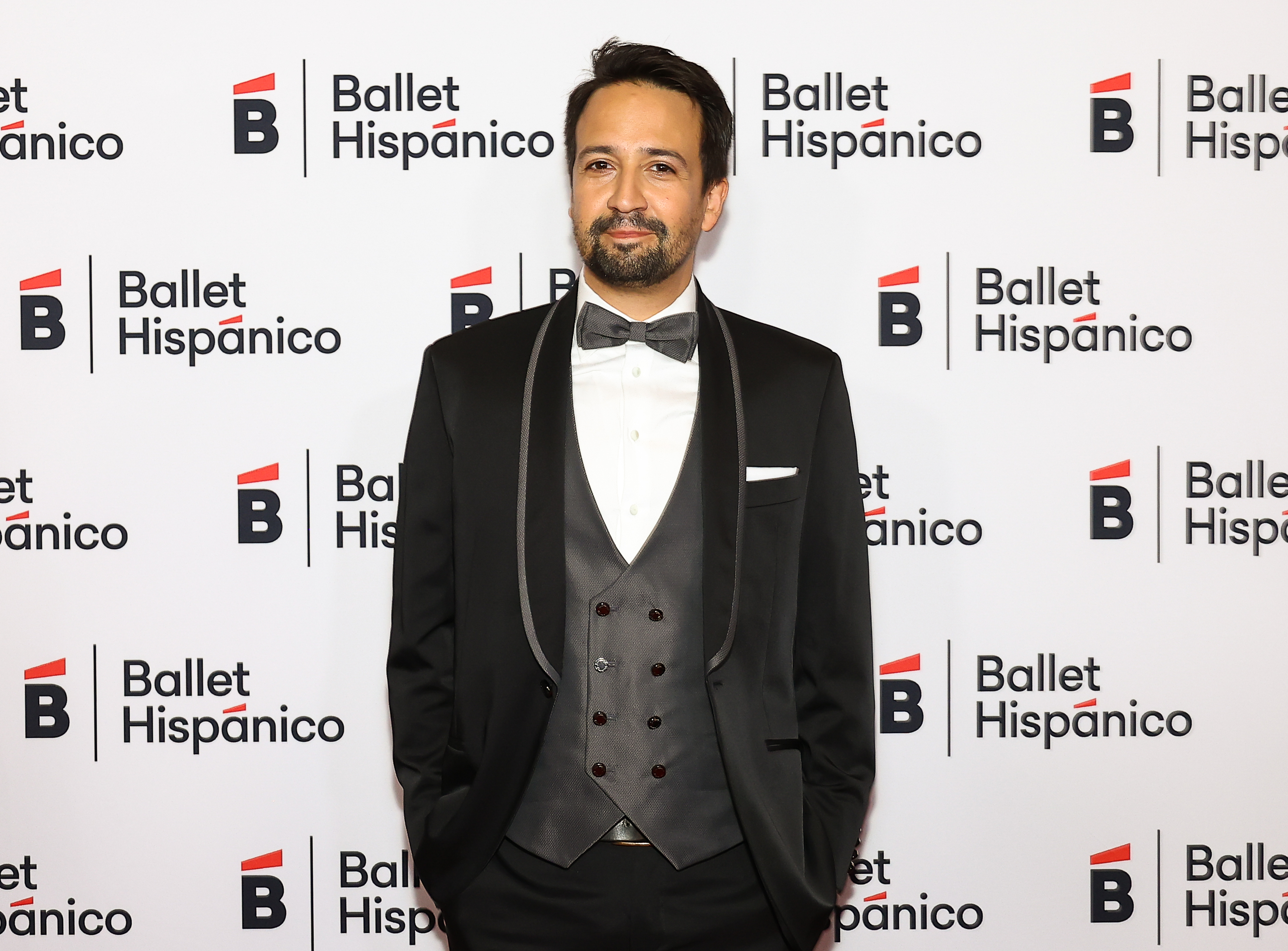 Close-up of Lin-Manuel in a bow tie at a media event