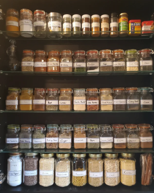inside of a spice cabinet, neatly organized