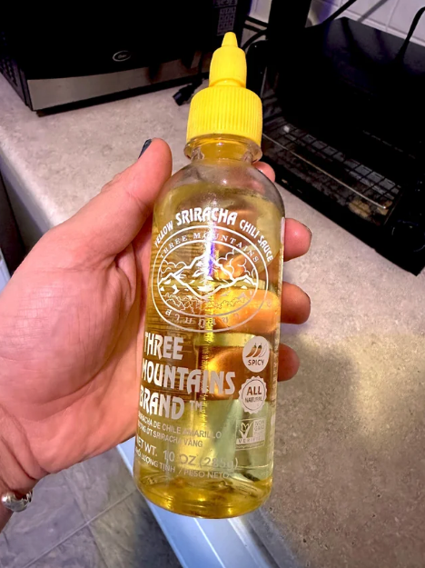 sriracha bottle filled with oil