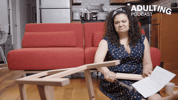 woman knocking over halfway assembled furniture with a hammer