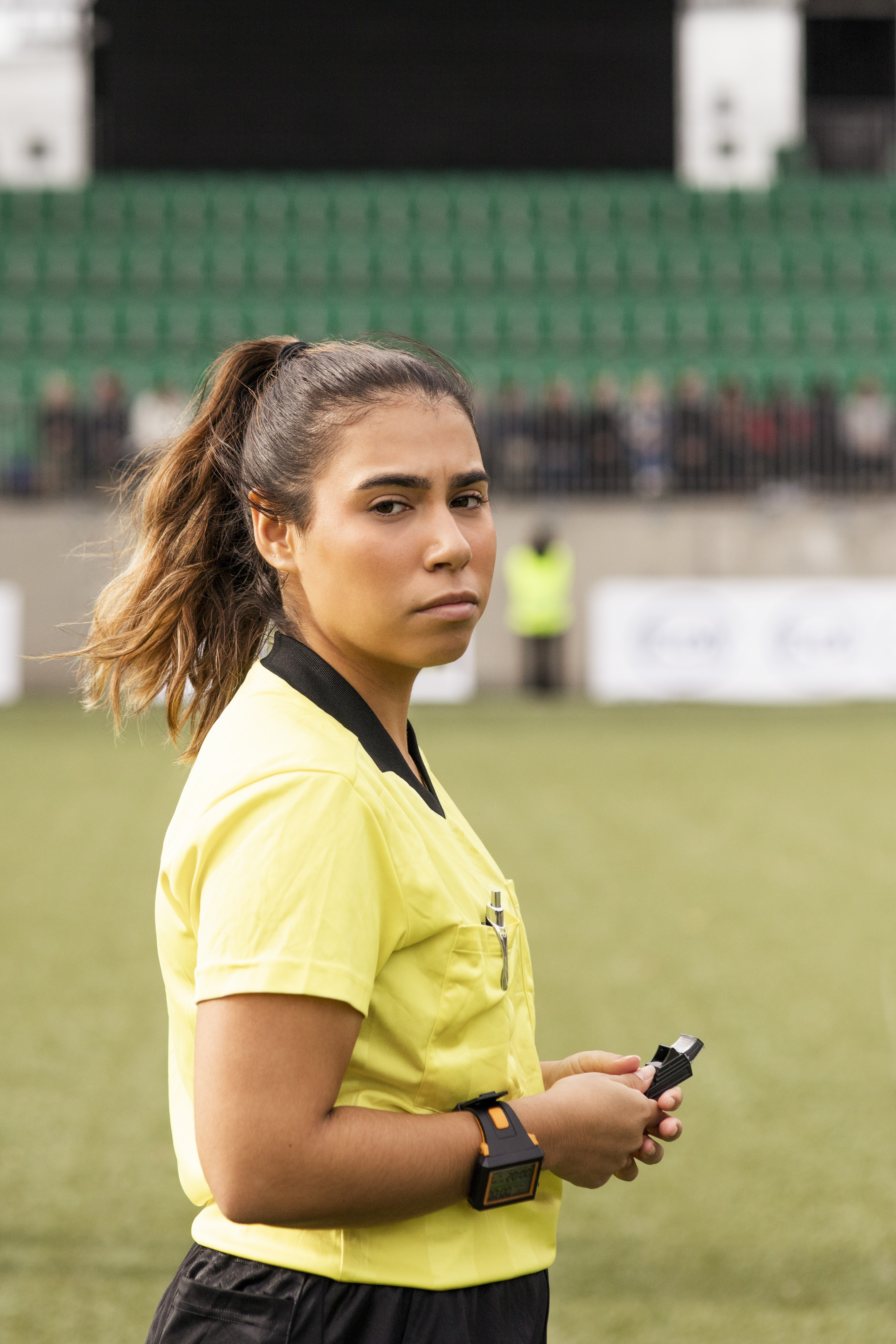 woman refereeing a soccer game