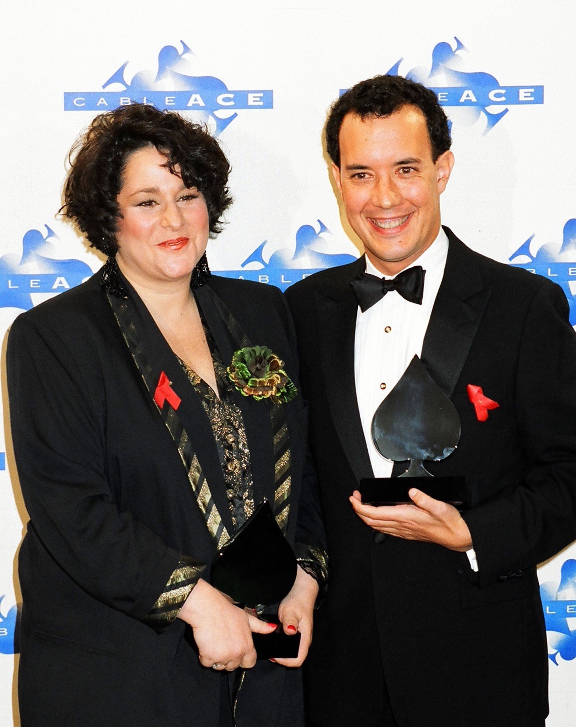 Marta Kauffman and David Crane at a media event holding awards