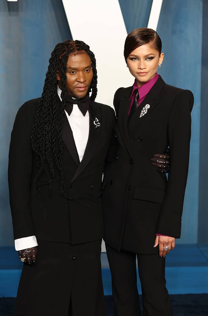 Close-up of Law and Zendaya at a media event. Both of them are wearing suits