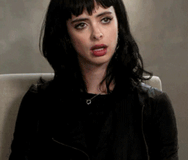 Krysten Ritter rolling her eyes and putting her head down
