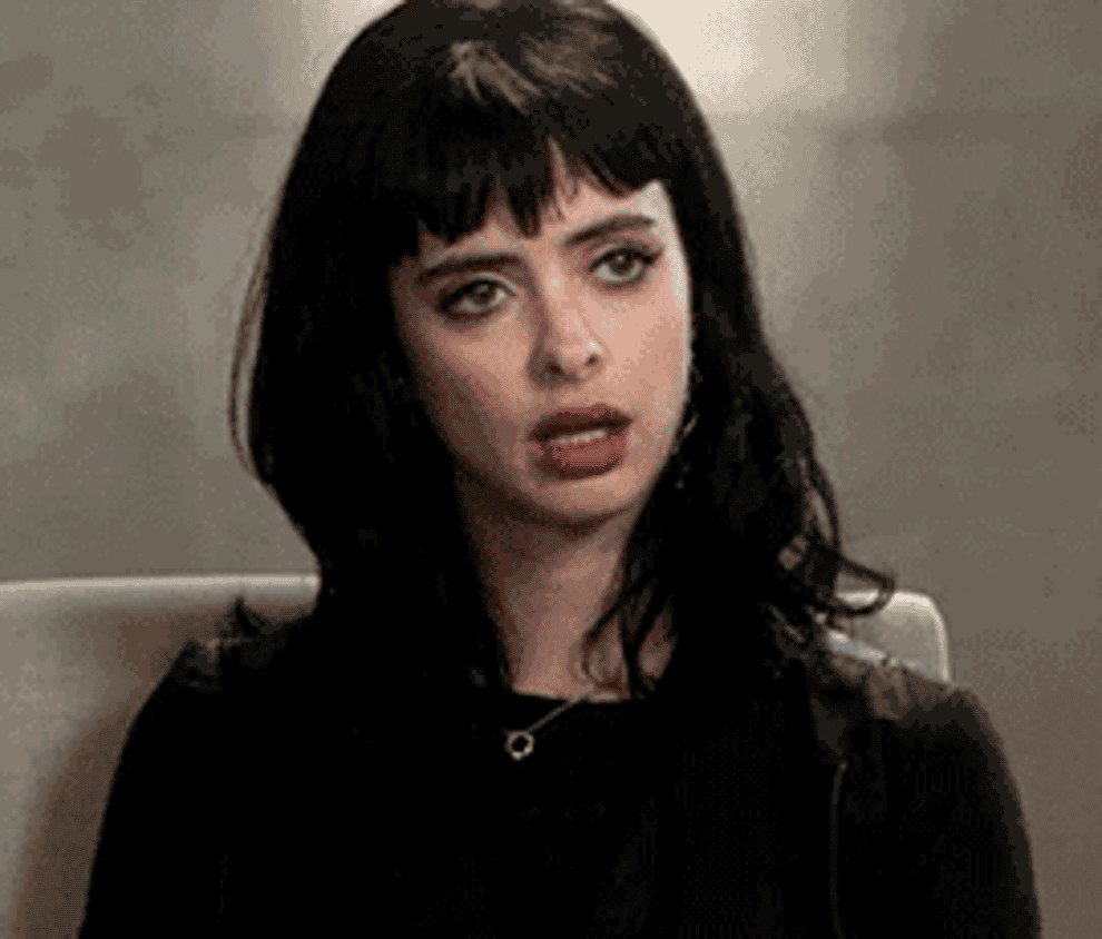 Krysten Ritter rolling her eyes and putting her head down