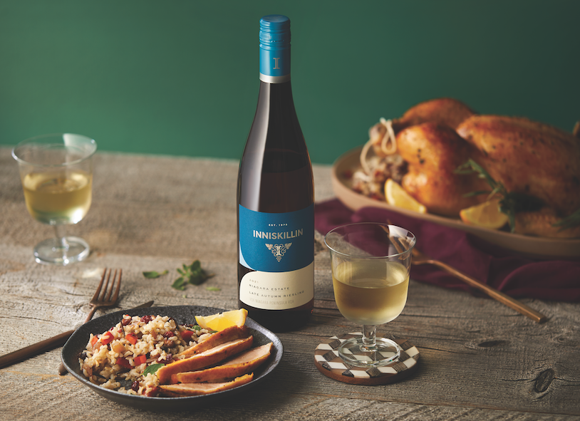 bottle of white wine with a plate of turkey