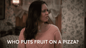 A woman saying, &quot;who puts fruit on pizza&quot;