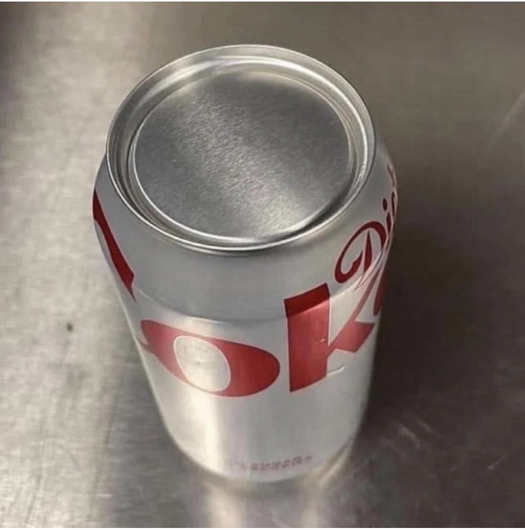 A Diet Coke can with the wrong side up