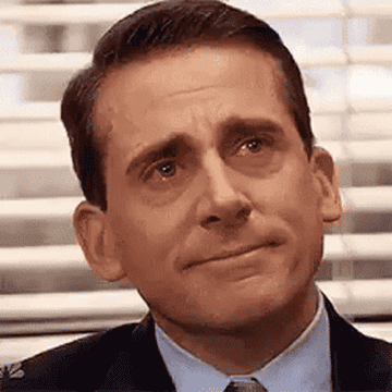 Michael Scott from The Office smiling with tears in his eyes