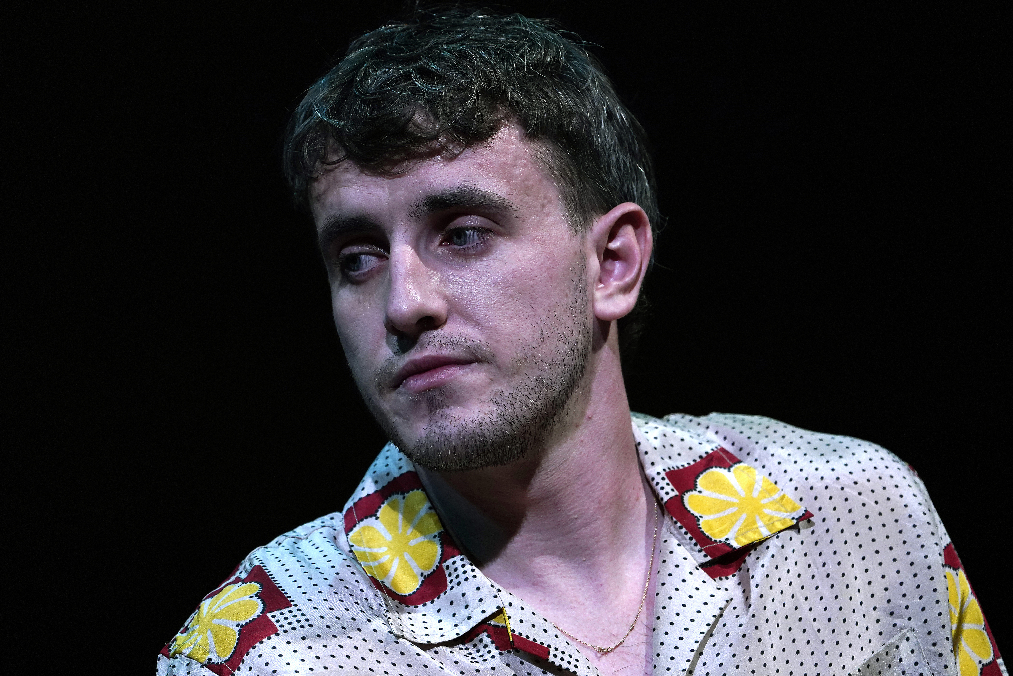 Close-up of Paul in a colorful shirt