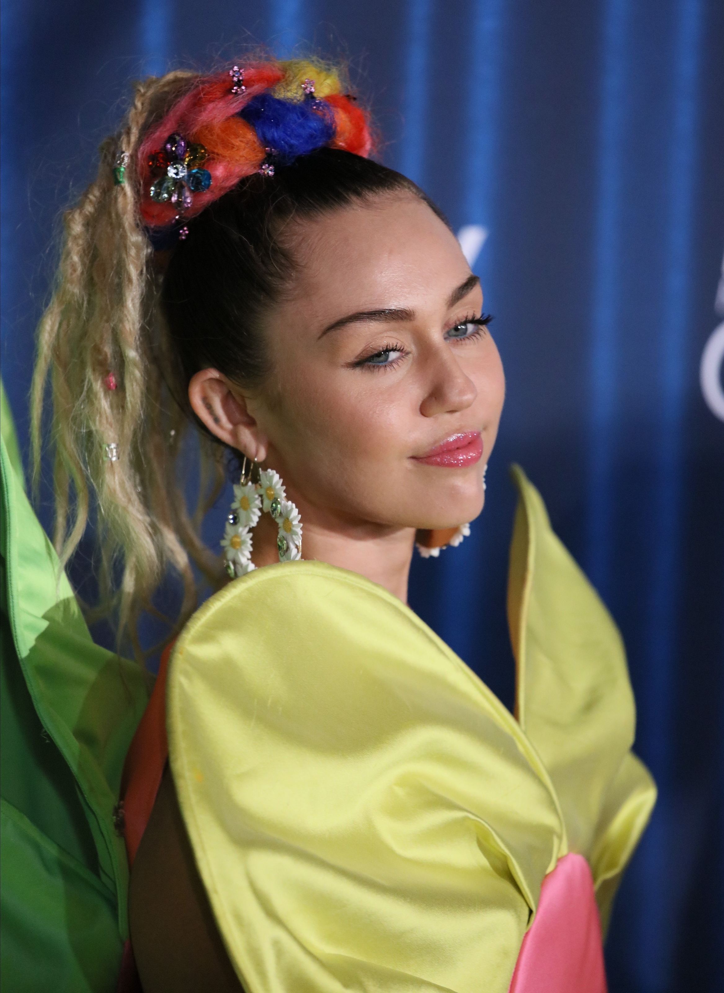 Close-up of Miley in a colorful outfit