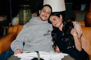 Pete Davidson smiles for a photo as Chase Sui Wonders rests her head on his shoulder