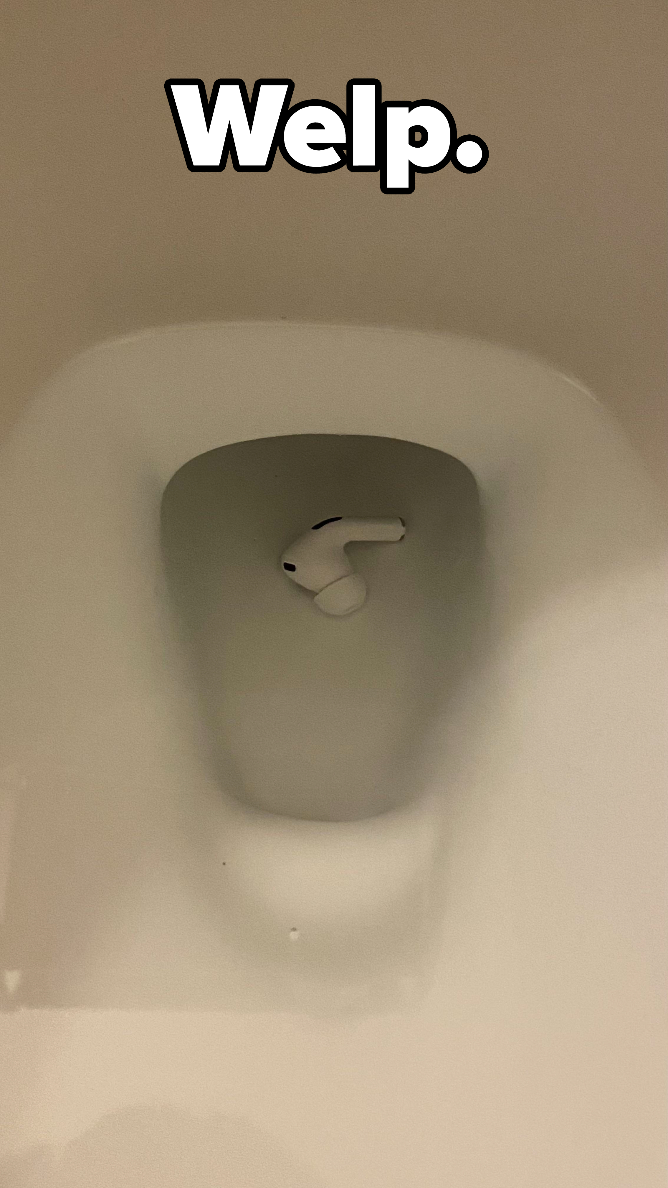 An AirPod in a toilet
