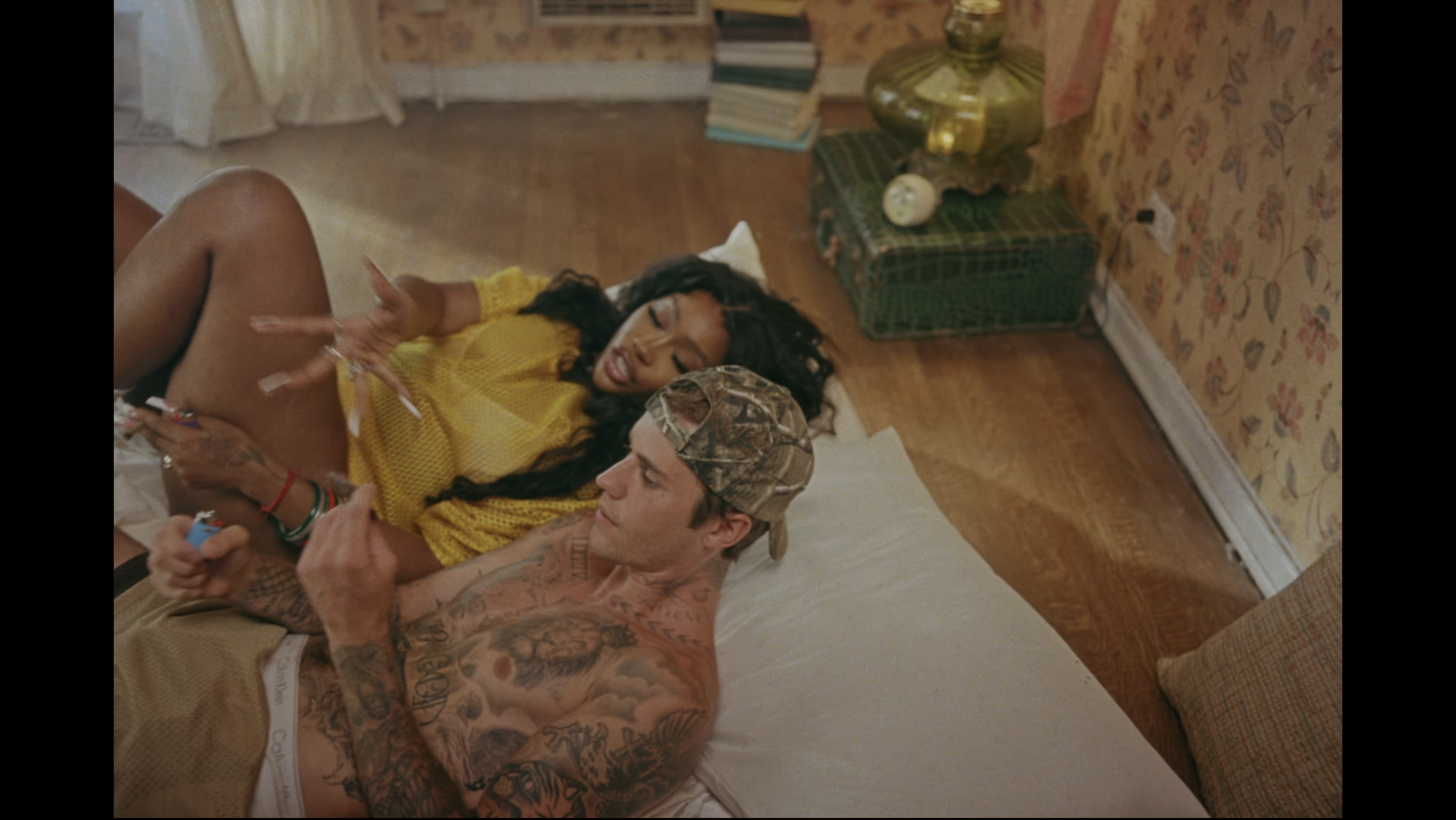 SZA and Justin lying in bed together