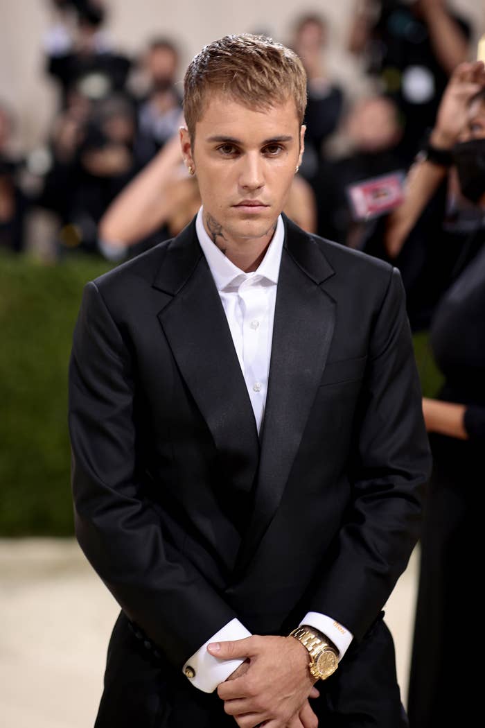 Close-up of Justin at a media event in a suit