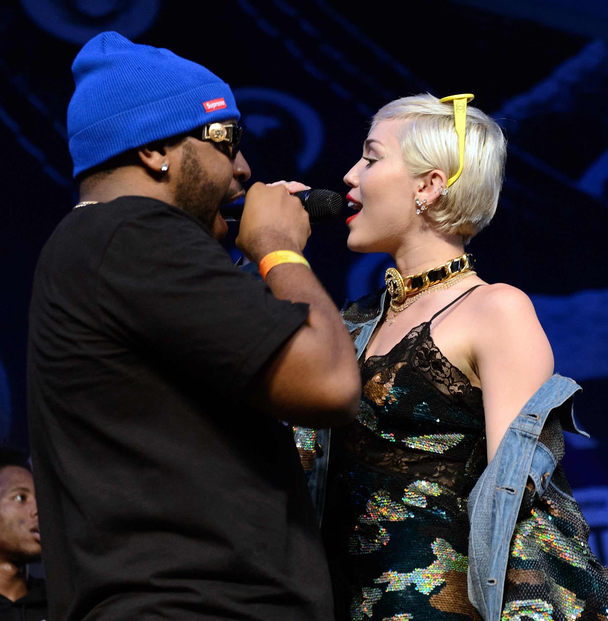 Close-up of Miley and Mike Will Made-It performing onstage