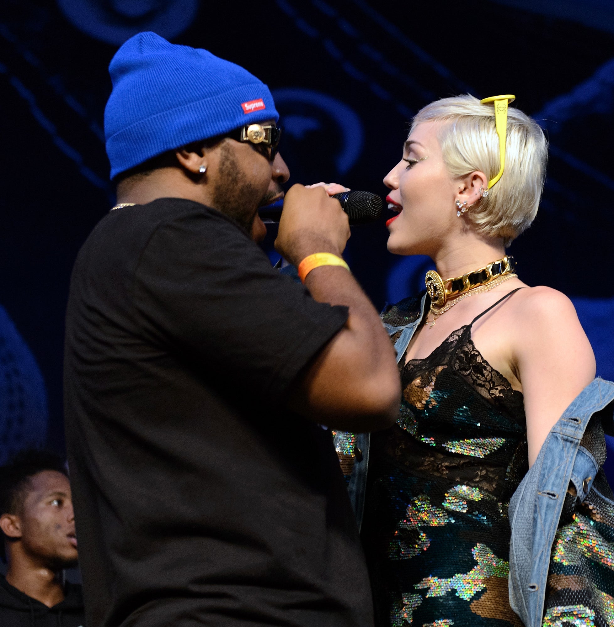 Close-up of Miley and Mike Will Made-It performing onstage