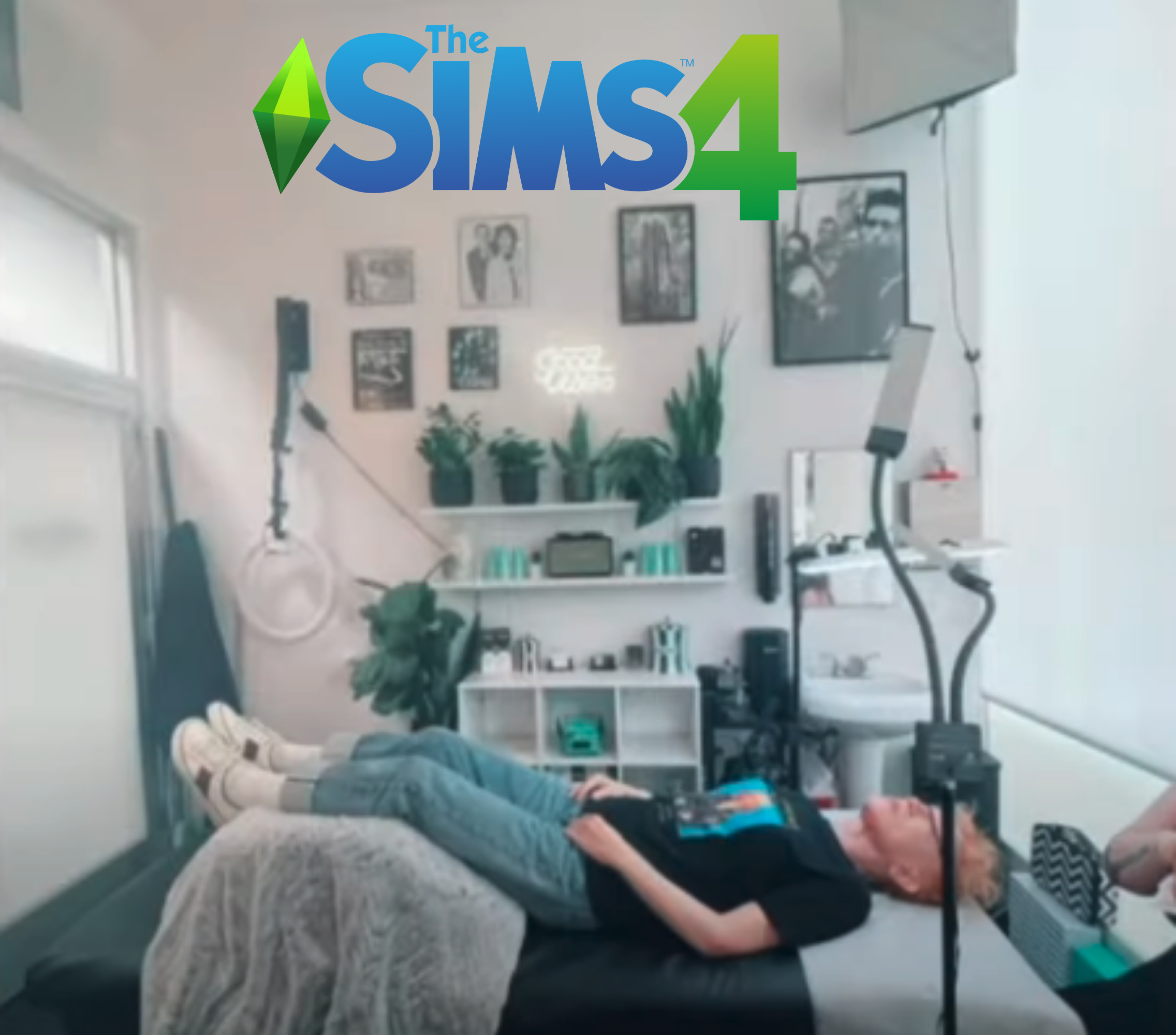 her lying on a table and a sims logo added to the photo