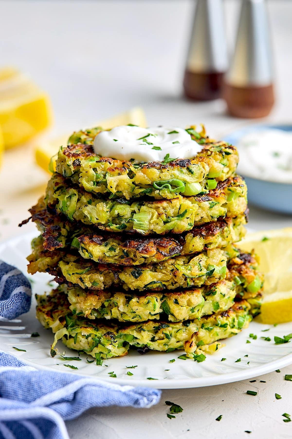 stacked zucchini fritters on a plate