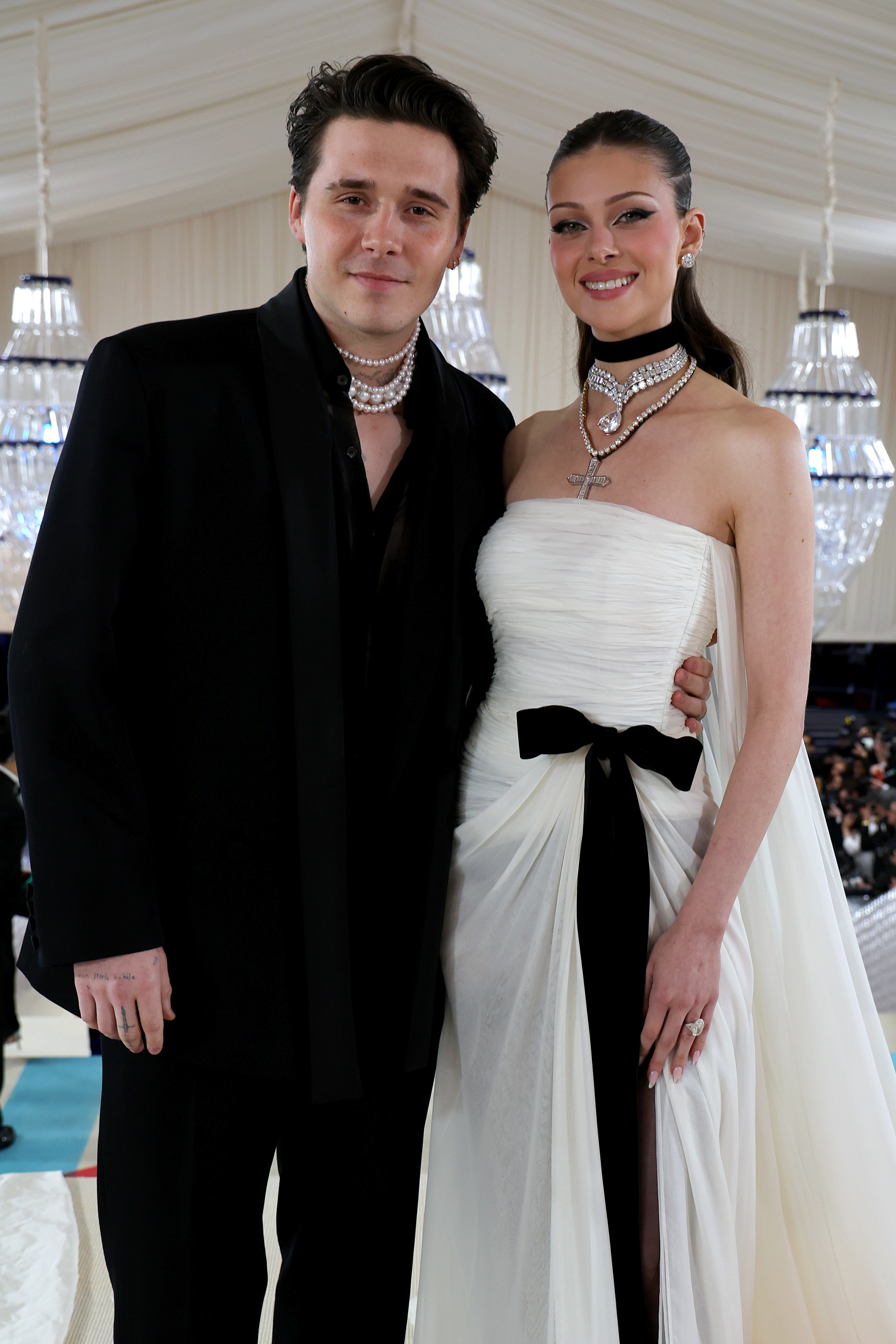 Brooklyn and Nicola Peltz Beckham at a formal event