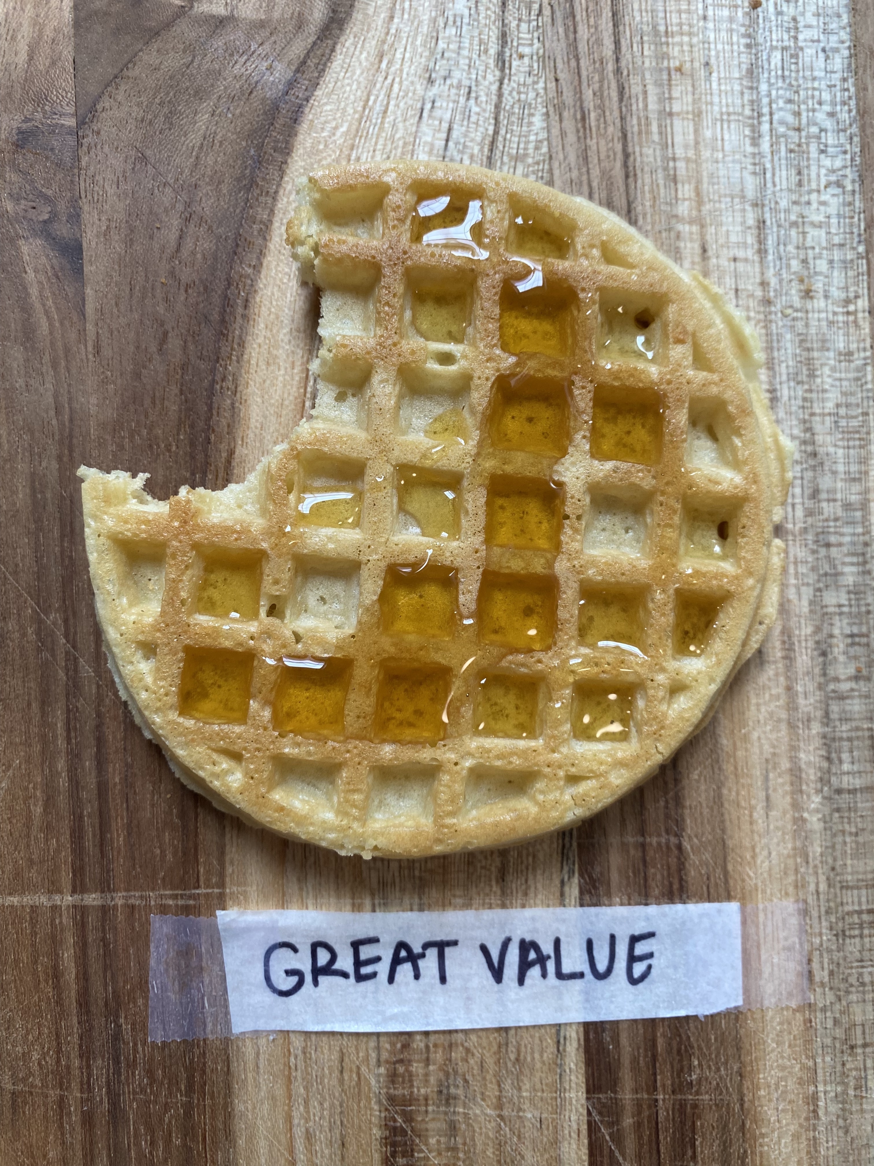 a great value waffles with syrup on it