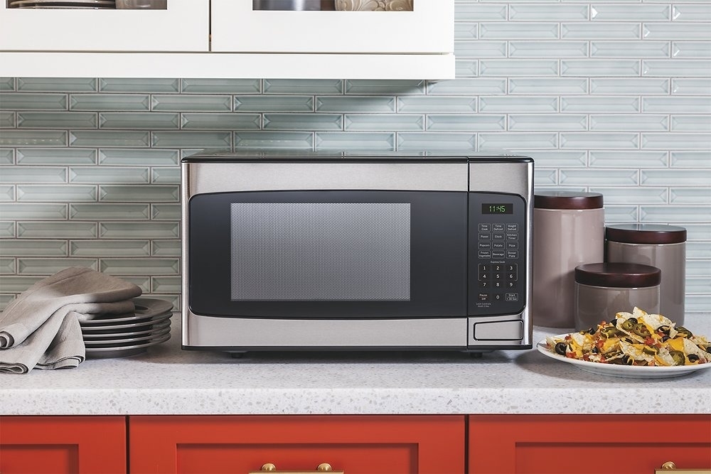silver GE microwave in a kitchen