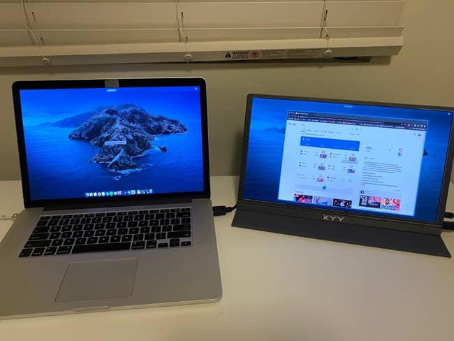 a reviewer photo of a laptop with the portable monitor connected