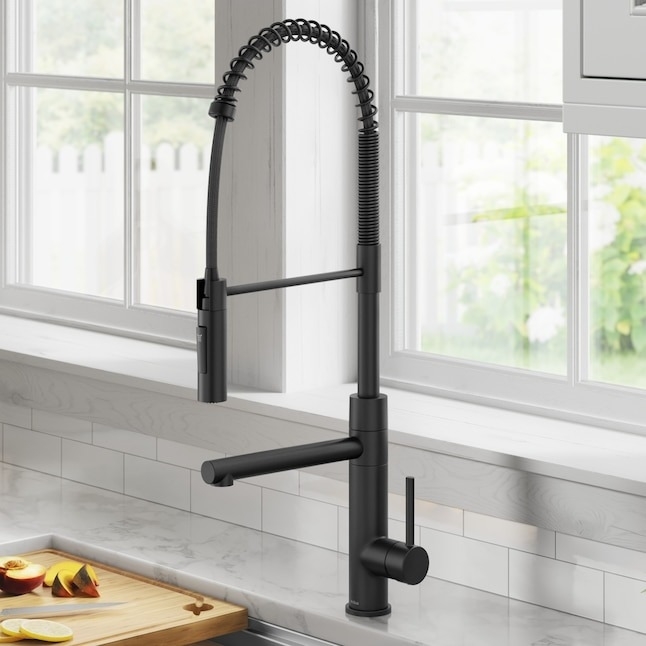 matte black pull-down handle kitchen faucet above sink