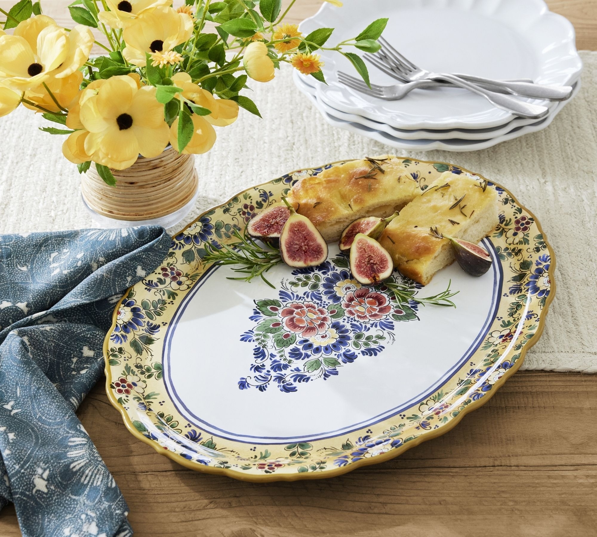 oval-shaped floral serving platter with food on it