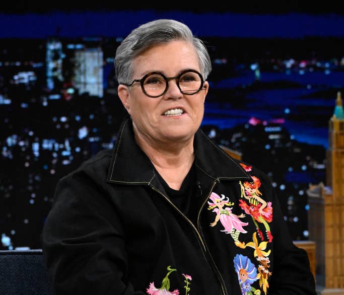 Closeup of Rosie O&#x27;Donnell smiling as she wears an embroidered outfit