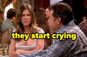 Rachel from "Friends" on a date with a man who is crying.