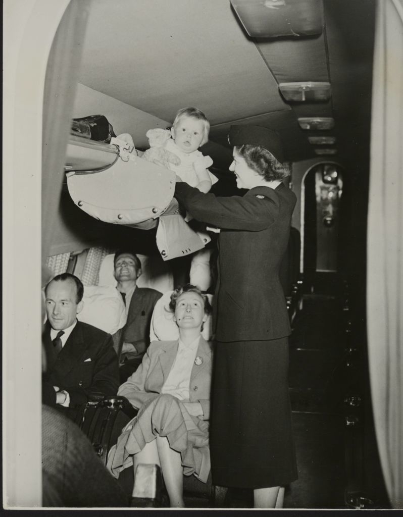 A baby in a luggage compartment