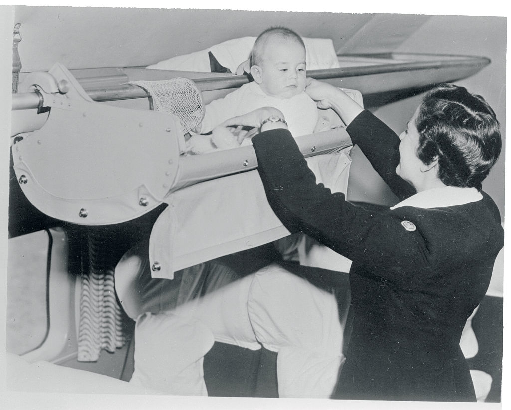 A baby in a luggage compartment