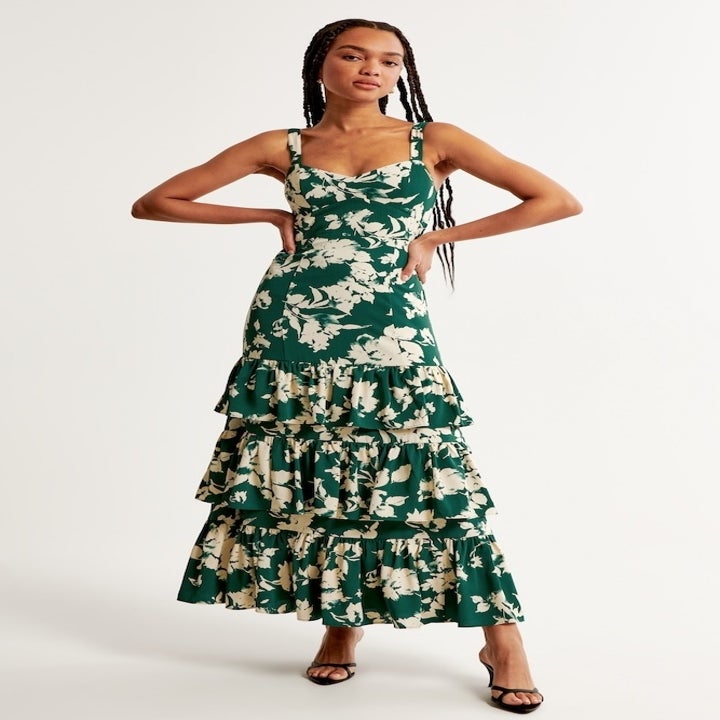 model in green floral dress