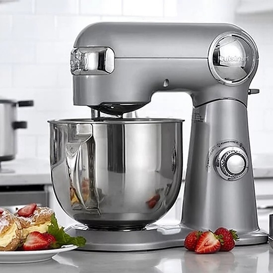chrome Cuisinart stand mixer on counter next to plate of food