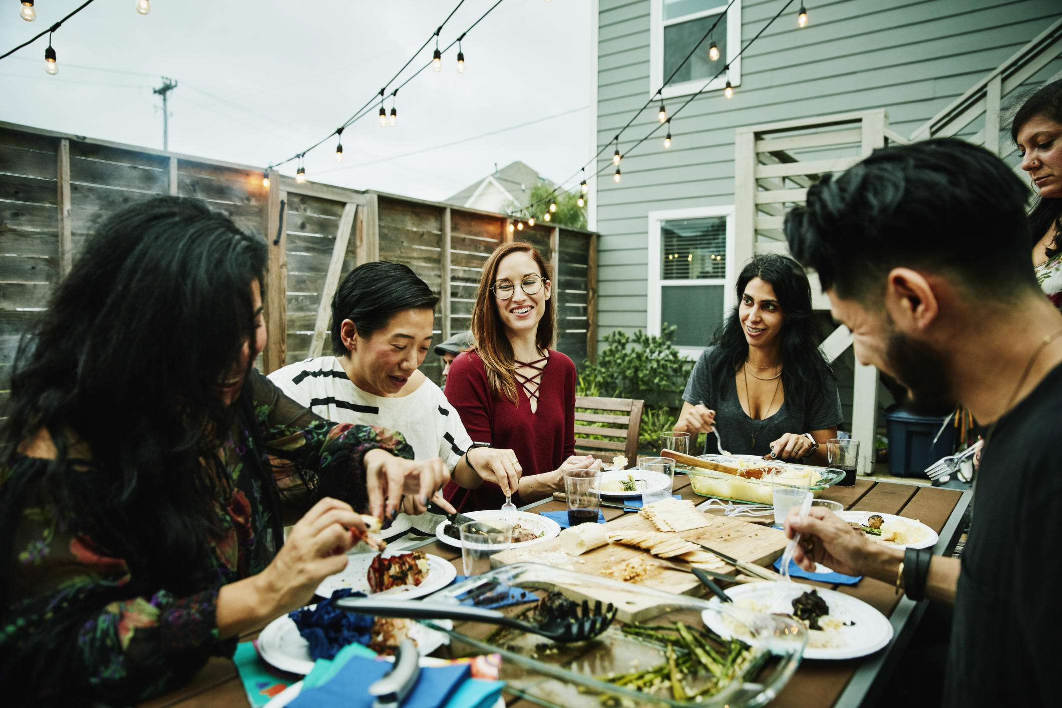 A group of friends are eating dinner