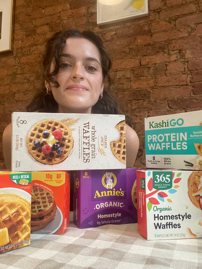 Claudia posing with boxes of waffles